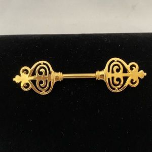 Vintage Ginnie Johansen gold tone bar brooch
